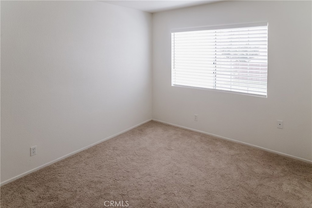 3880 West Jacinto View Road, Unit A Banning, CA 92220 - Photo 15 of 21 an empty room with a window