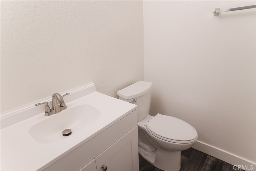 3880 West Jacinto View Road, Unit A Banning, CA 92220 - Photo 16 of 21 a bathroom with a toilet sink and mirror