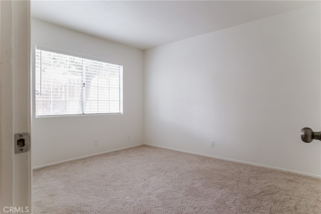 3880 West Jacinto View Road, Unit A Banning, CA 92220 - Photo 10 of 21 an empty room with a window
