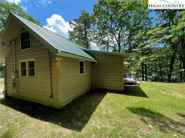 a view of a backyard with a large tree