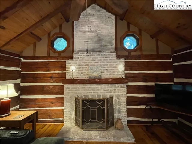 a view of livingroom with furniture and a fireplace