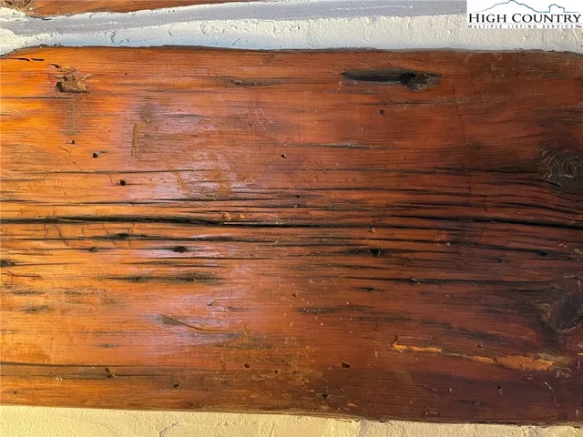 a view of room with wooden floor