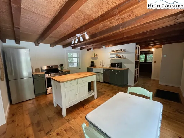 a kitchen with counter top space and stainless steel appliances