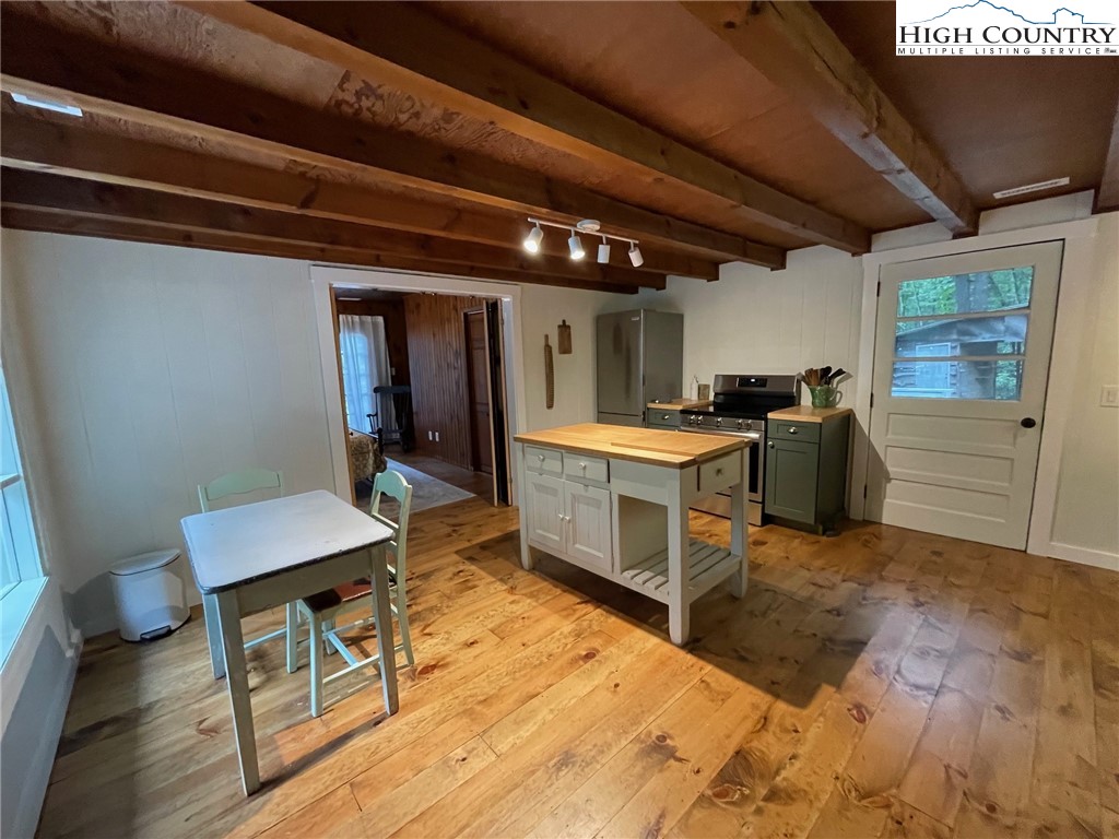 217 Holiday Hills Drive Boone, NC 28607 - Photo 21 of 47 a room with a table chairs and a stove
