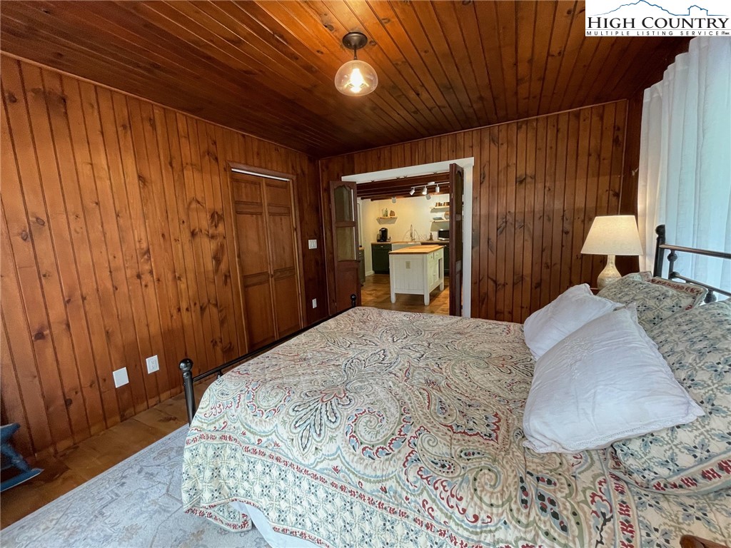 217 Holiday Hills Drive Boone, NC 28607 - Photo 27 of 47 a bedroom with a large bed and a dresser