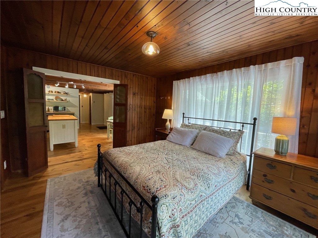 217 Holiday Hills Drive Boone, NC 28607 - Photo 28 of 47 a bed room with a bed and a large window