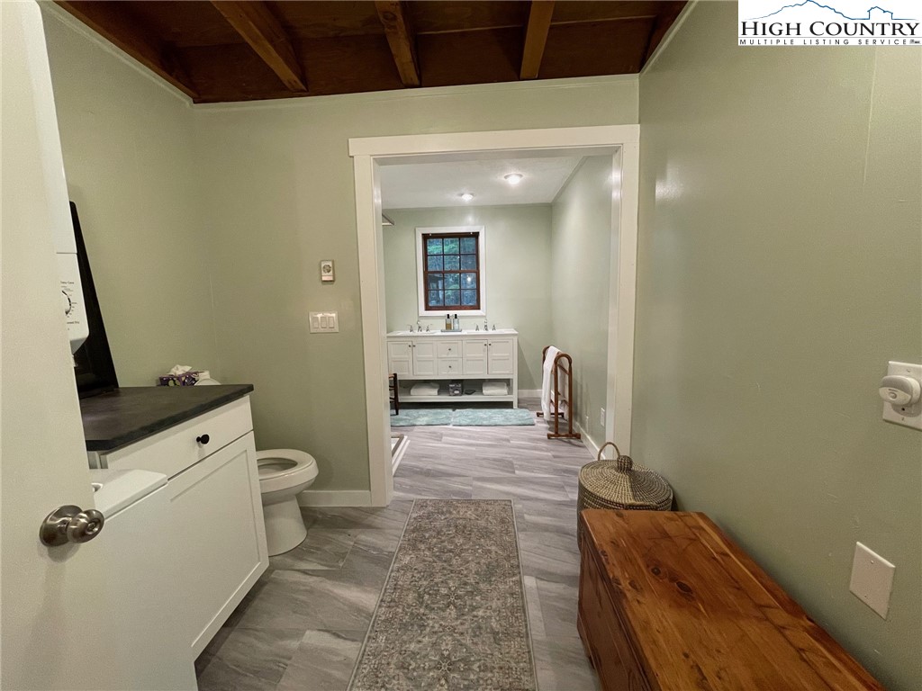 217 Holiday Hills Drive Boone, NC 28607 - Photo 29 of 47 a bathroom with a toilet sink and mirror