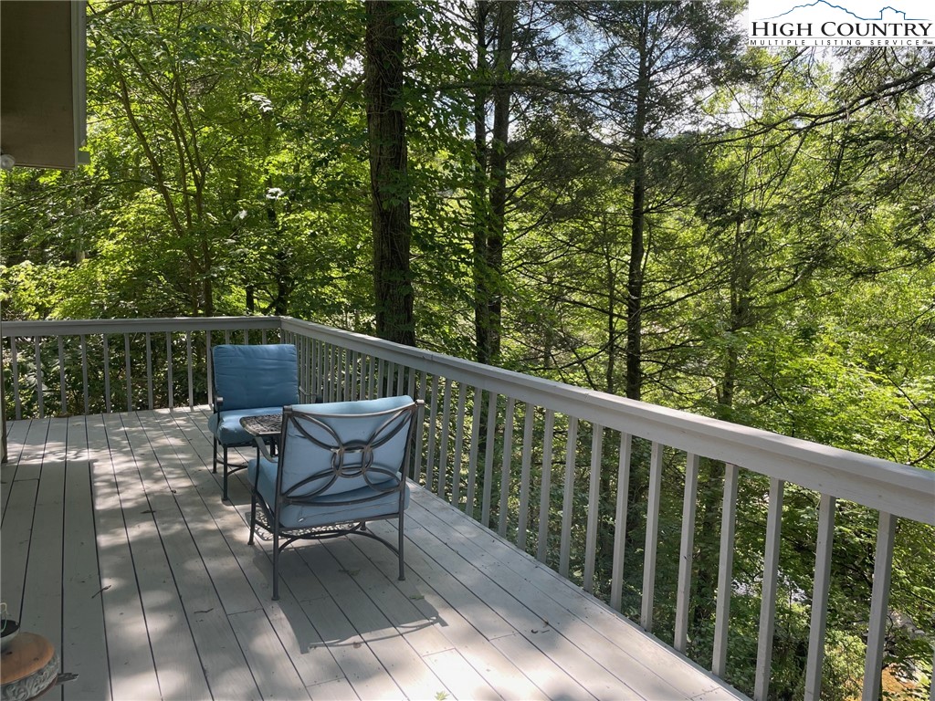 217 Holiday Hills Drive Boone, NC 28607 - Photo 7 of 47 a view of a two chair in the balcony