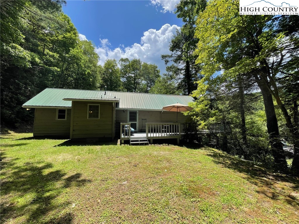 217 Holiday Hills Drive Boone, NC 28607 - Photo 10 of 47 a front view of house with yard and trees
