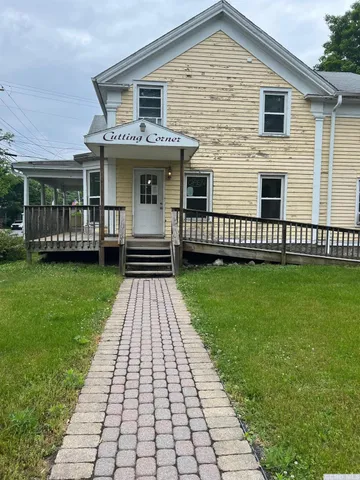 a front view of a house with a yard