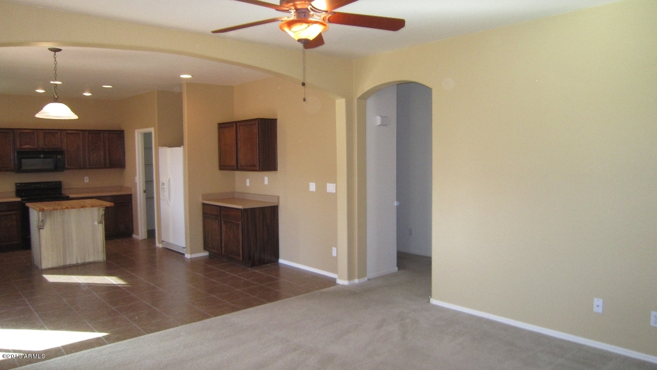 44107 Roth Road Maricopa, AZ 85138 - Photo 9 of 41 great room and kitchen
