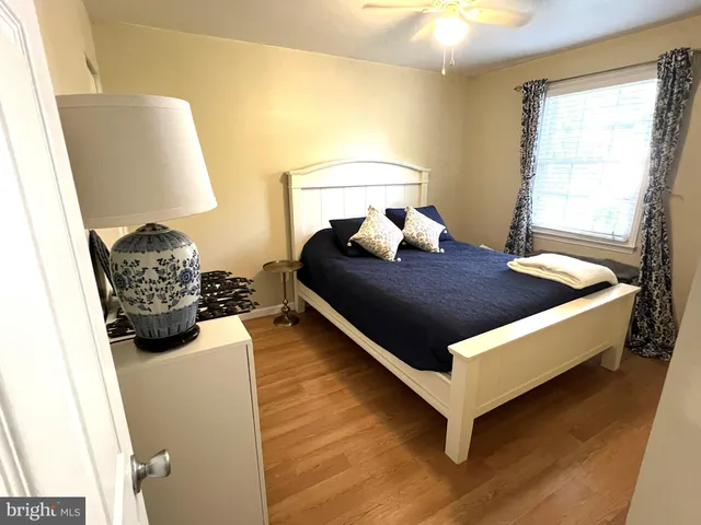 a bed room with a bed and a window