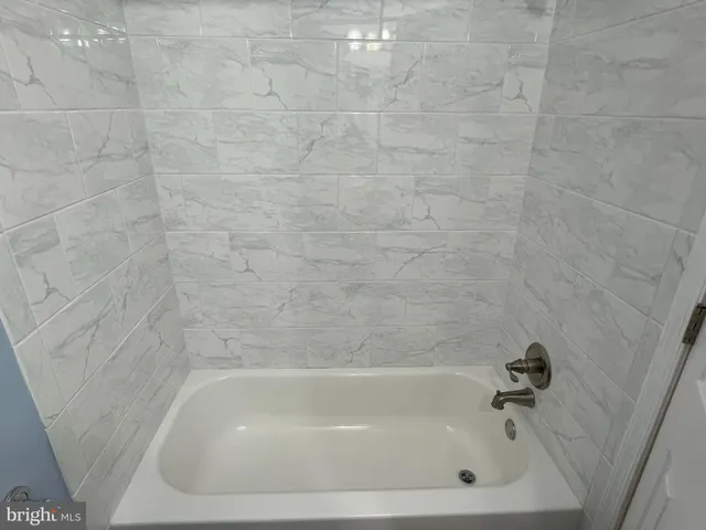 a close up of a bathtub in a bathroom