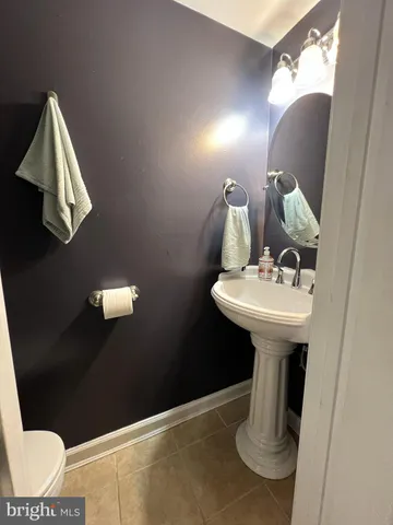 a bathroom with a sink and mirror