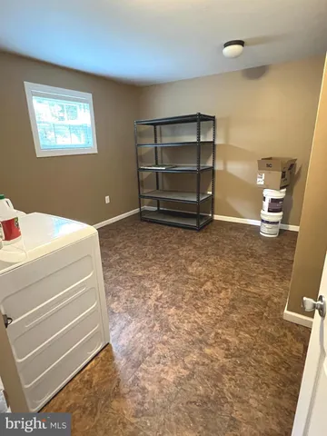 a room with a furniture and a window