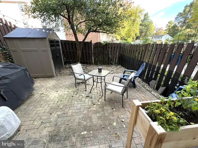 a view of backyard with outdoor seating