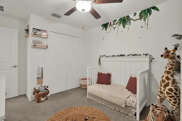 a bedroom with furniture and a chandelier