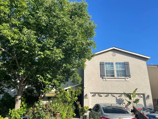 a view of a house with a small yard