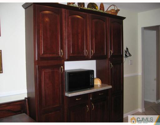 3 Kyle Road Somerset, NJ 08873 - Photo 7 of 10 a bathroom with a sink and cabinets
