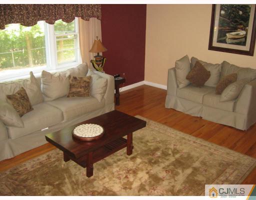 3 Kyle Road Somerset, NJ 08873 - Photo 8 of 10 a living room with furniture and a large window