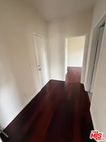 an empty room with wooden floor