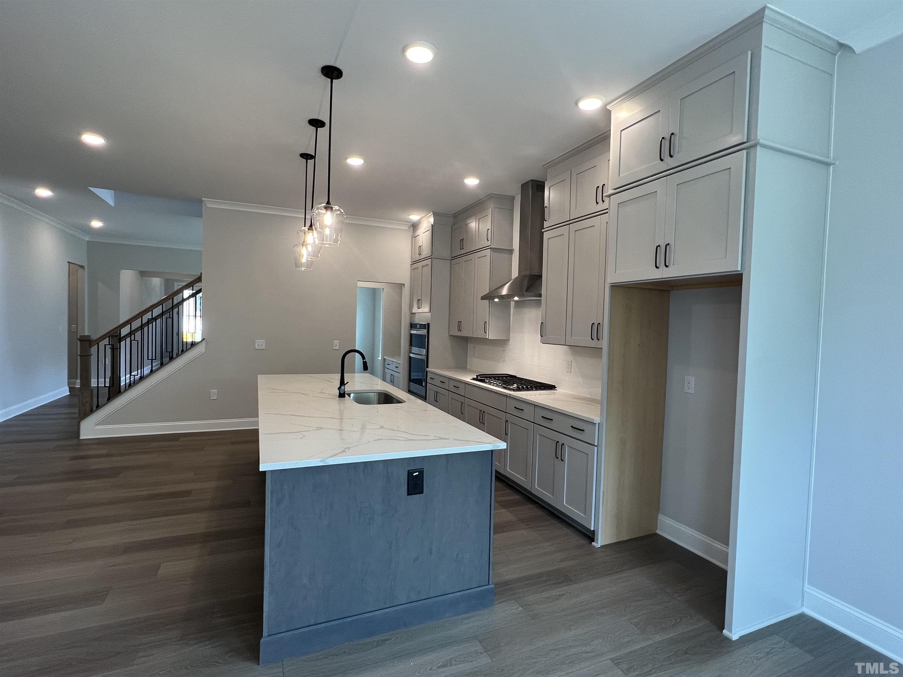 7629 Hasentree Way, Unit 519 Wake Forest, NC 27587 - Photo 22 of 76 a large kitchen with stainless steel appliances kitchen island a large island in the center