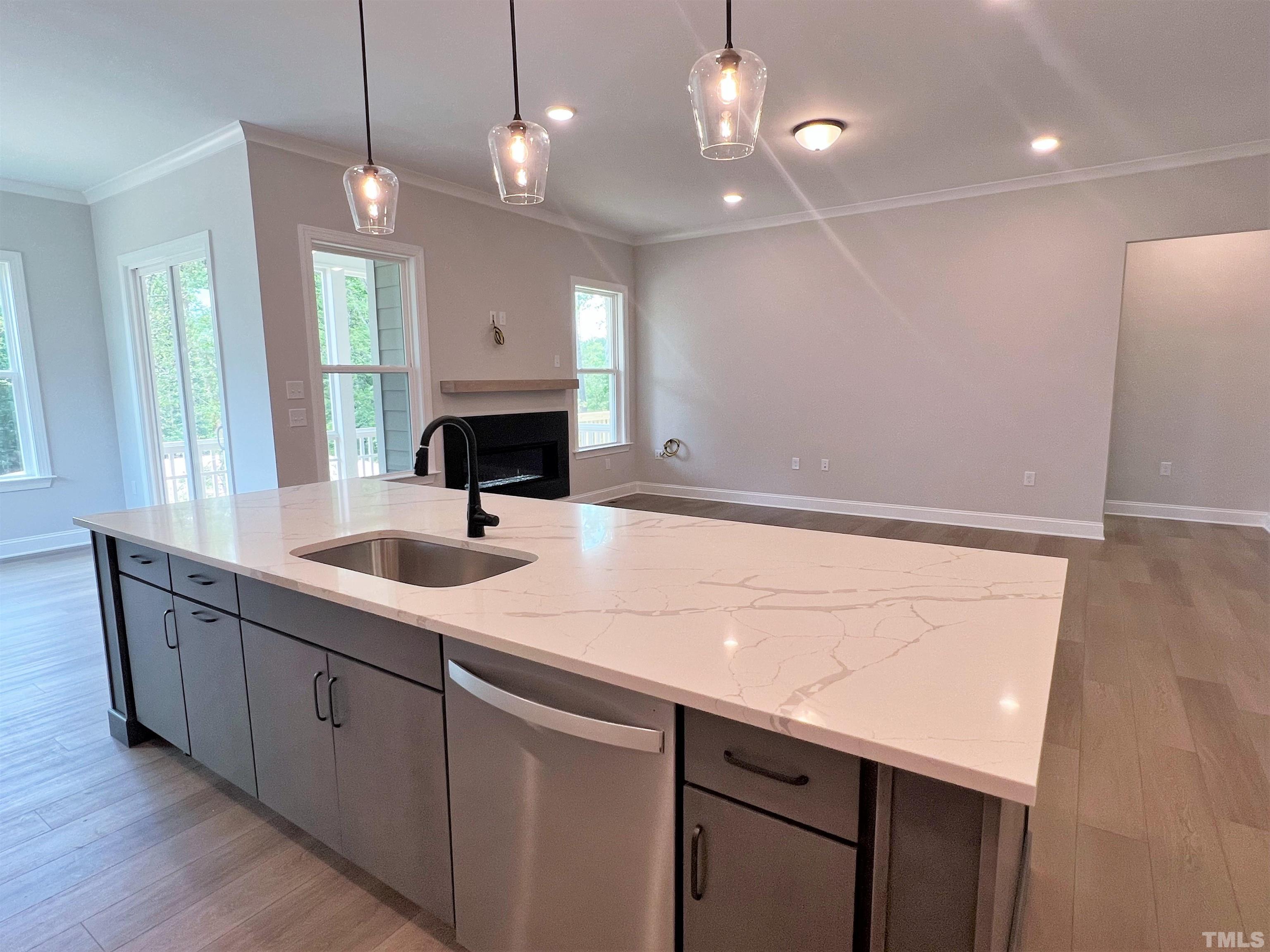 7629 Hasentree Way, Unit 519 Wake Forest, NC 27587 - Photo 23 of 76 a bathroom with a sink a vanity a mirror and a light fixture
