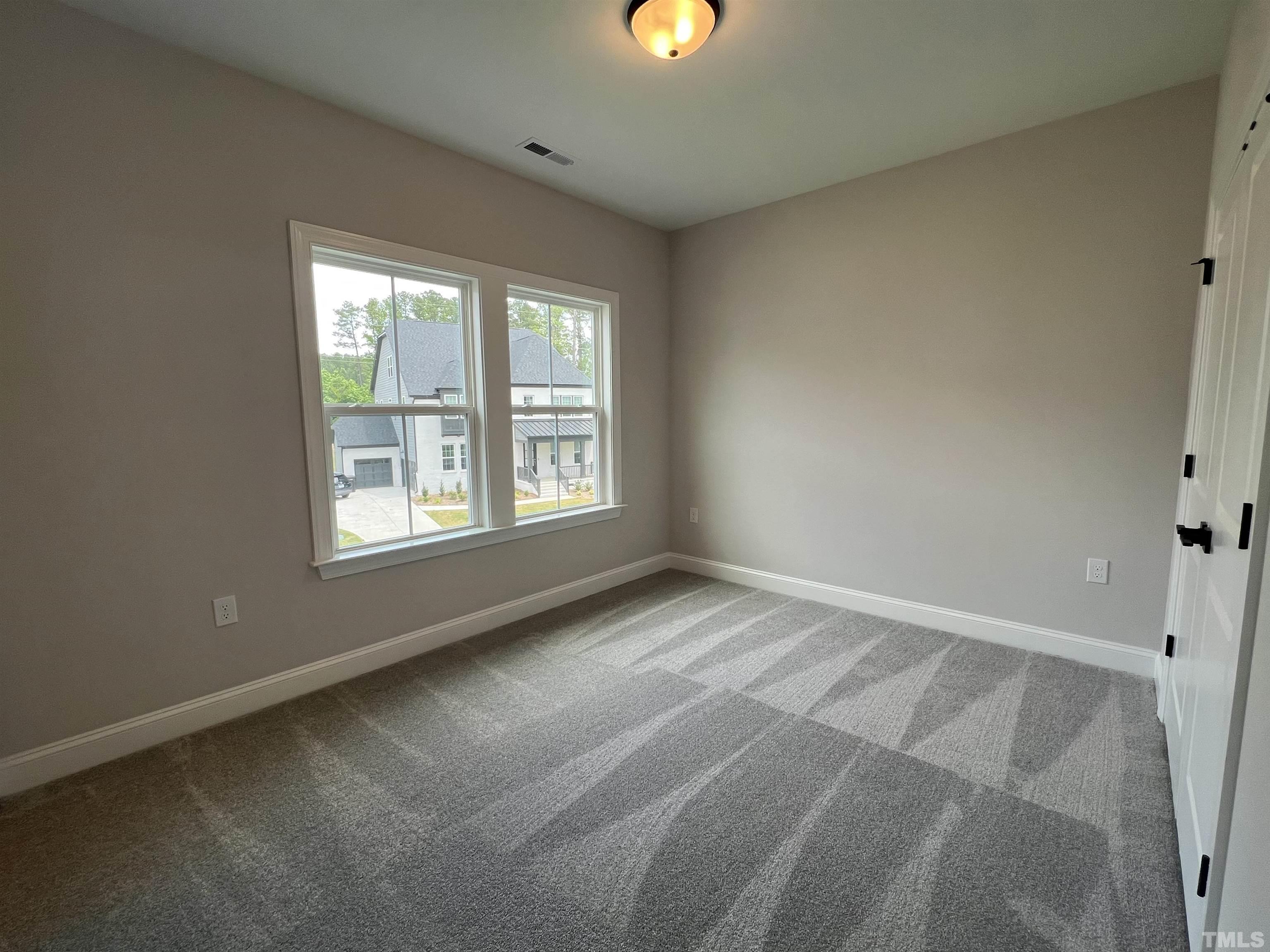 7629 Hasentree Way, Unit 519 Wake Forest, NC 27587 - Photo 38 of 76 a view of an empty room with a window