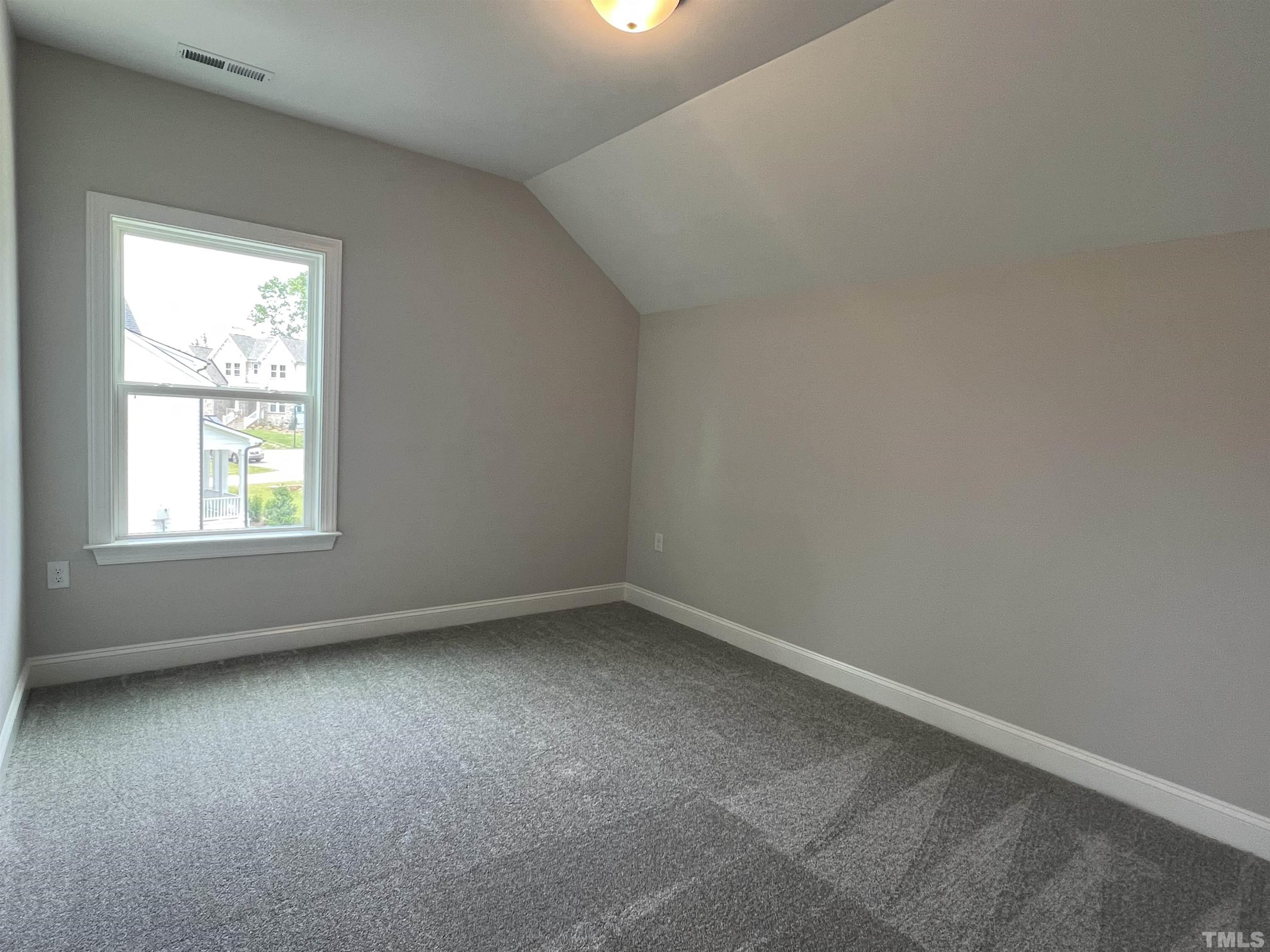 7629 Hasentree Way, Unit 519 Wake Forest, NC 27587 - Photo 44 of 76 an empty room with a window
