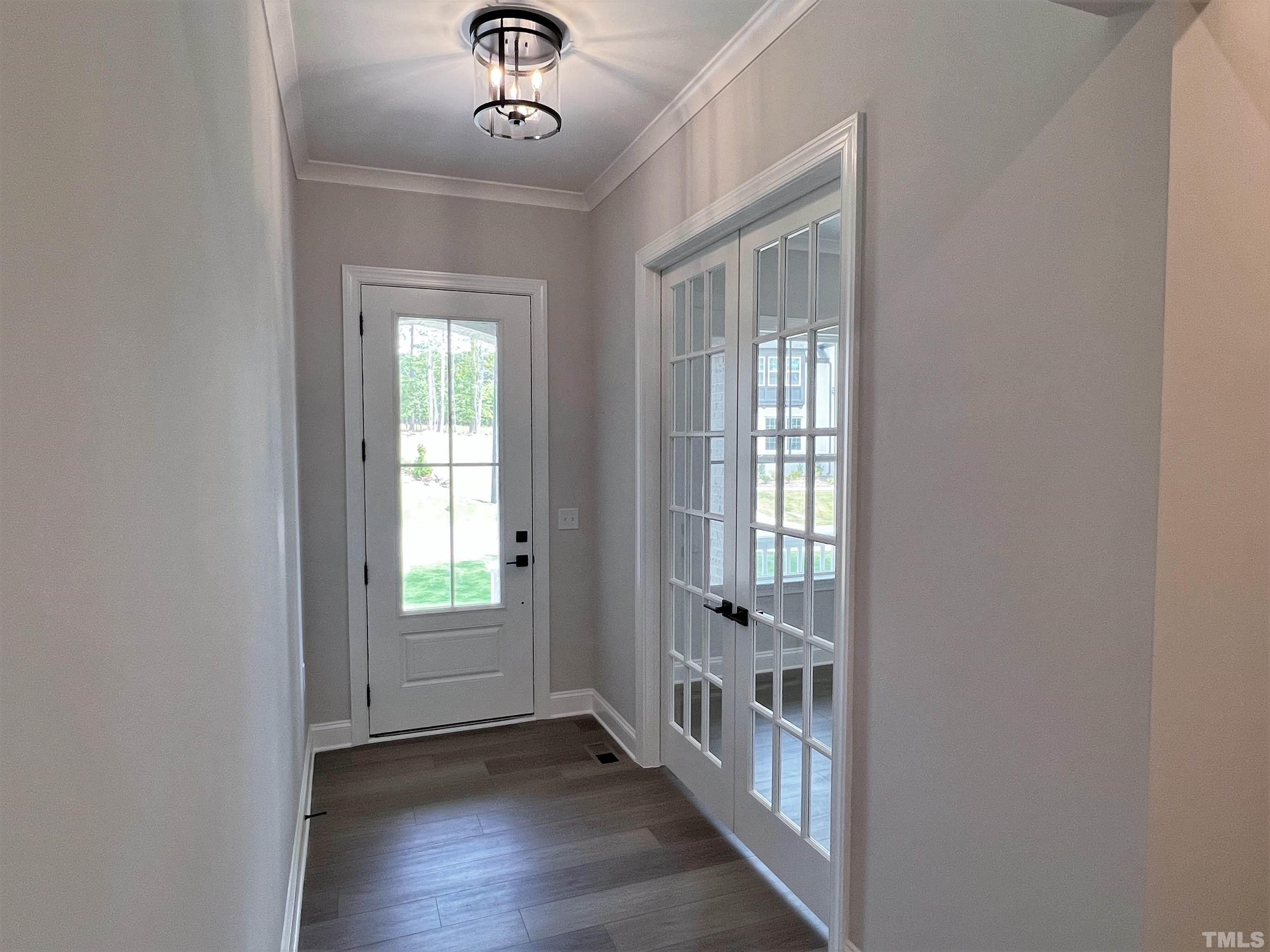 7629 Hasentree Way, Unit 519 Wake Forest, NC 27587 - Photo 7 of 76 a view of an entryway with wooden floor