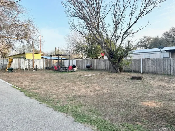 a view of wooden floor with a black white checkered floor