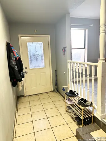 a kitchen with a dining table chairs and kitchen view