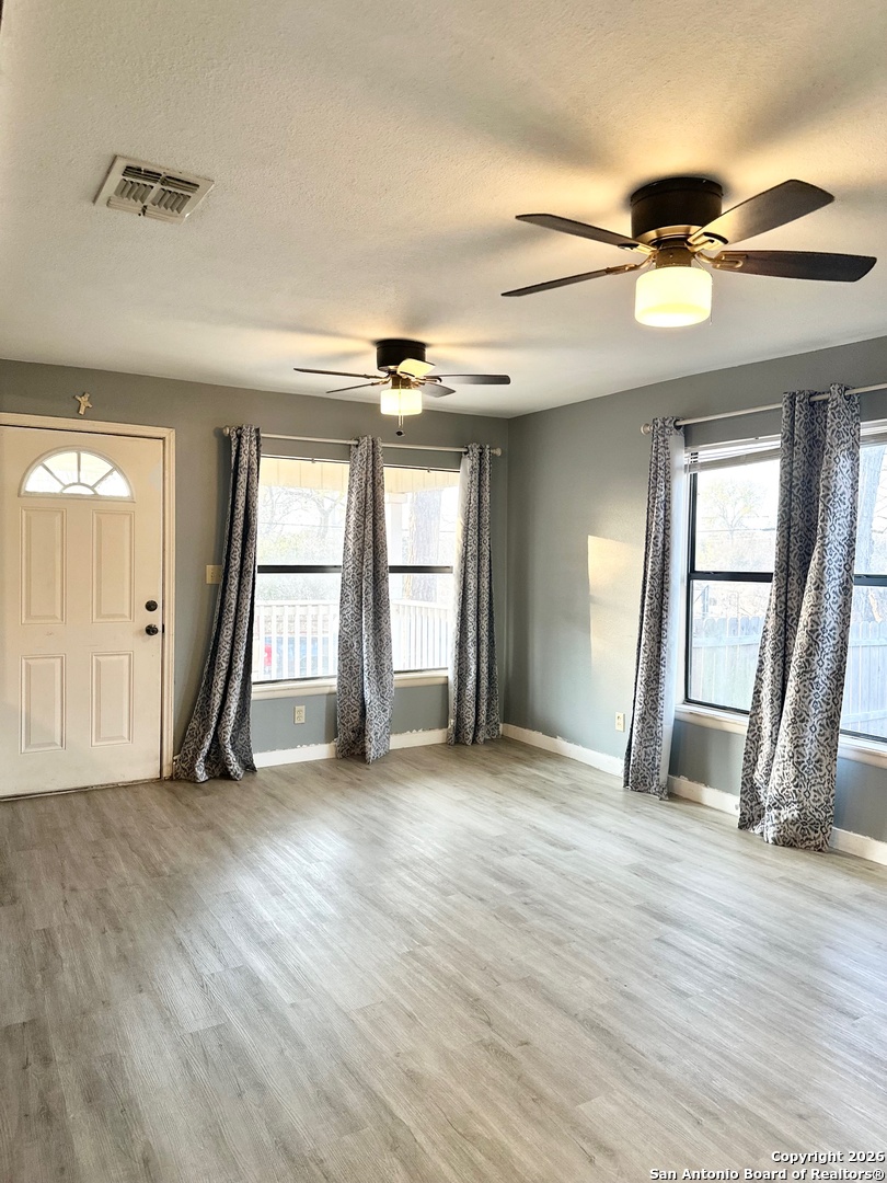 1608 The Ln Street Pleasanton, TX 78064 - Photo 7 of 10 a view of an empty room with a window