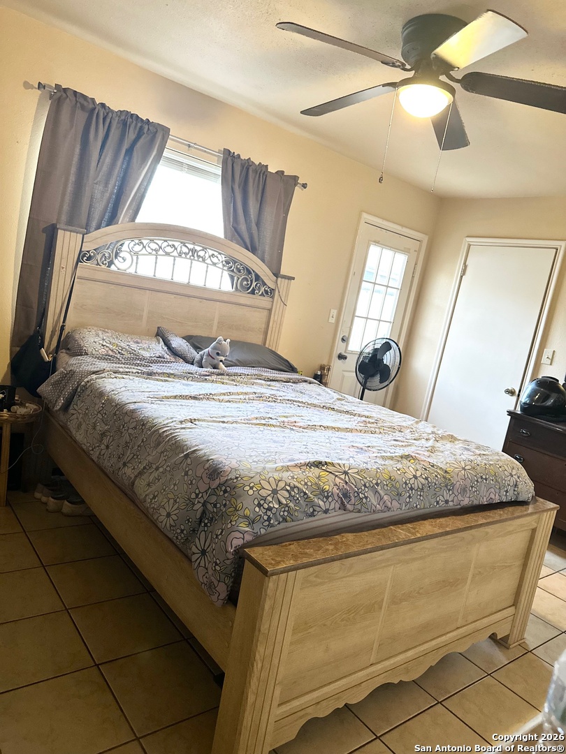 1608 The Ln Street Pleasanton, TX 78064 - Photo 10 of 10 a bedroom with a bed and wooden floor