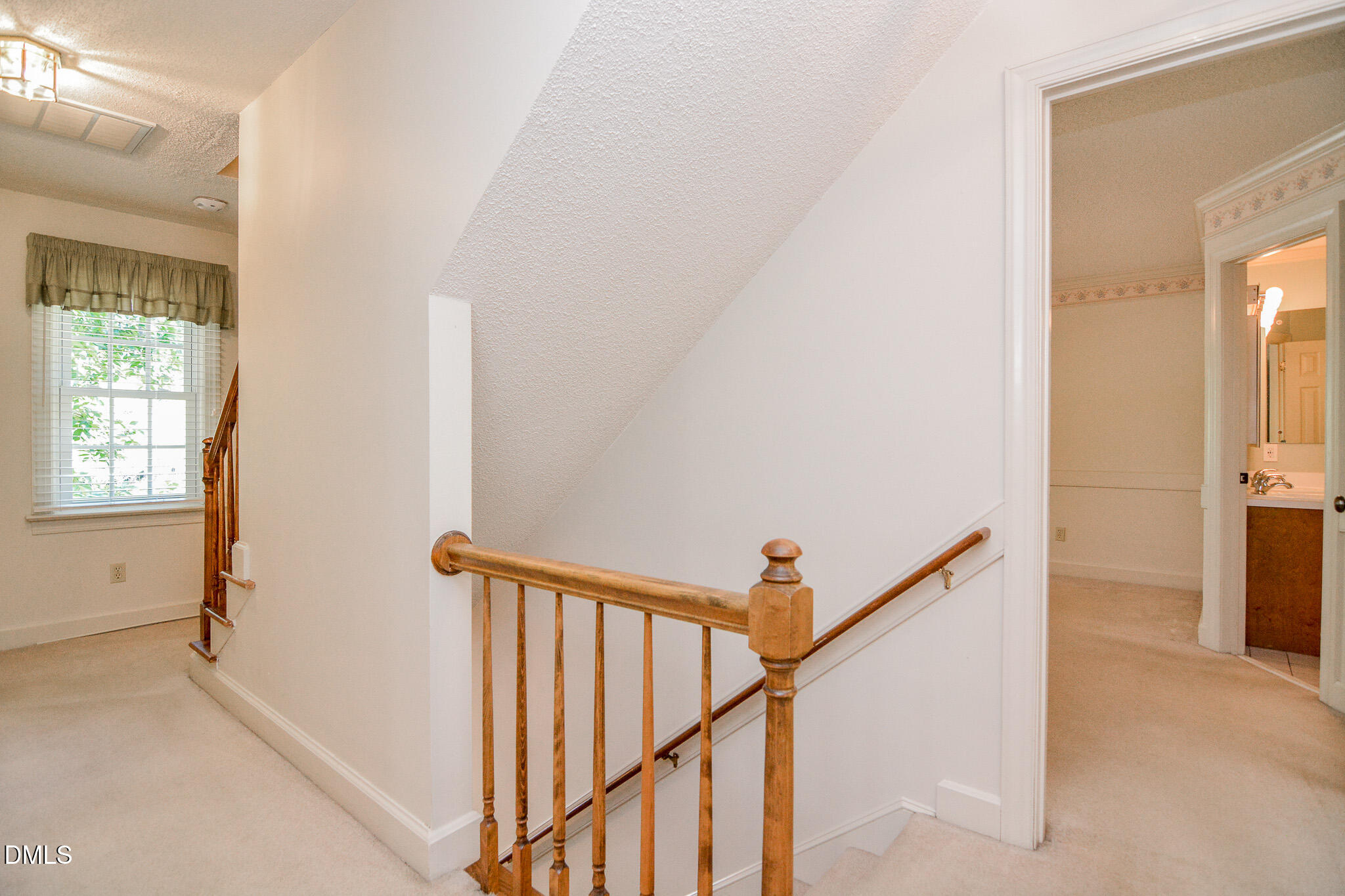 1215 Cambridge Road Northwest Wilson, NC 27896 - Photo 38 of 54 a view of a hallway with a white walls and a window