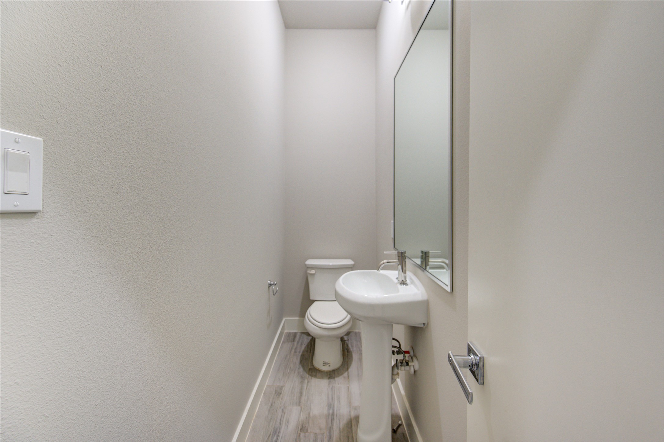 4536 Sunflower Street Houston, TX 77051 - Photo 13 of 27 a bathroom with a white toilet and a sink
