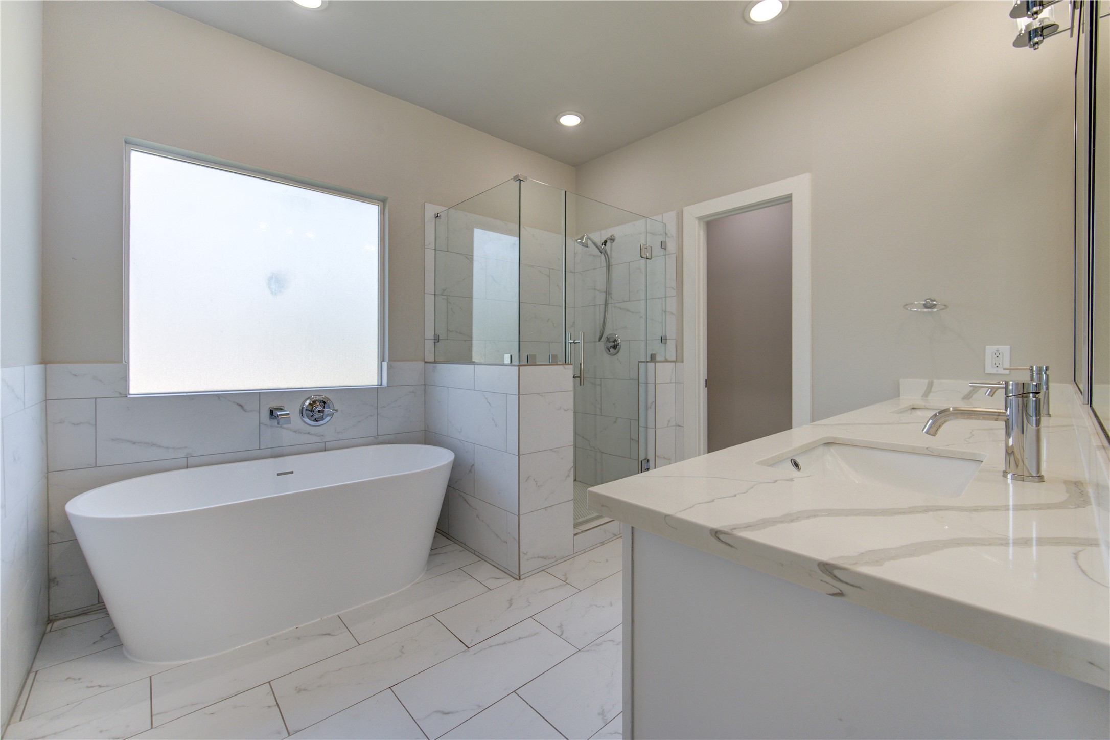 4536 Sunflower Street Houston, TX 77051 - Photo 16 of 27 a spacious bathroom with a bathtub and sink