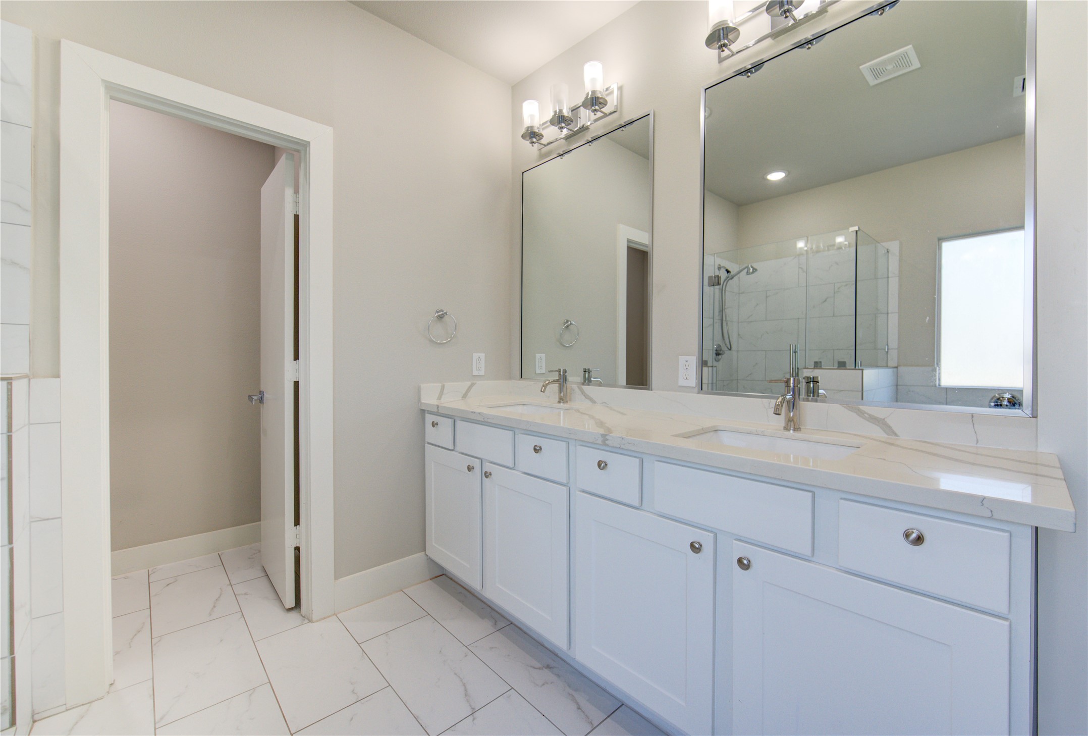 4536 Sunflower Street Houston, TX 77051 - Photo 17 of 27 a bathroom with double sink and a mirror