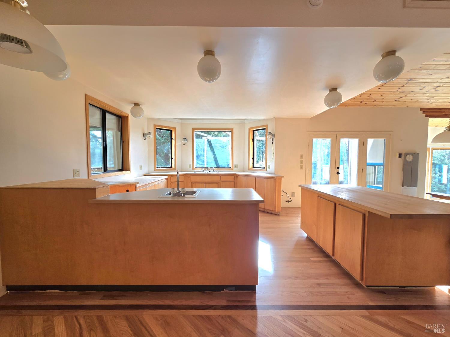 36955 Eureka Stagecoach Road Willits, CA 95490 - Photo 12 of 45 a large living room with stainless steel appliances kitchen island granite countertop a large kitchen counter top and stove