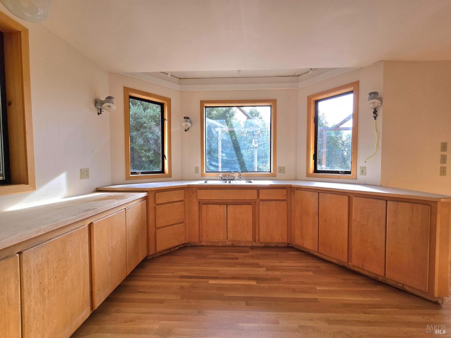 36955 Eureka Stagecoach Road Willits, CA 95490 - Photo 13 of 45 a large kitchen with a large window a sink and cabinets