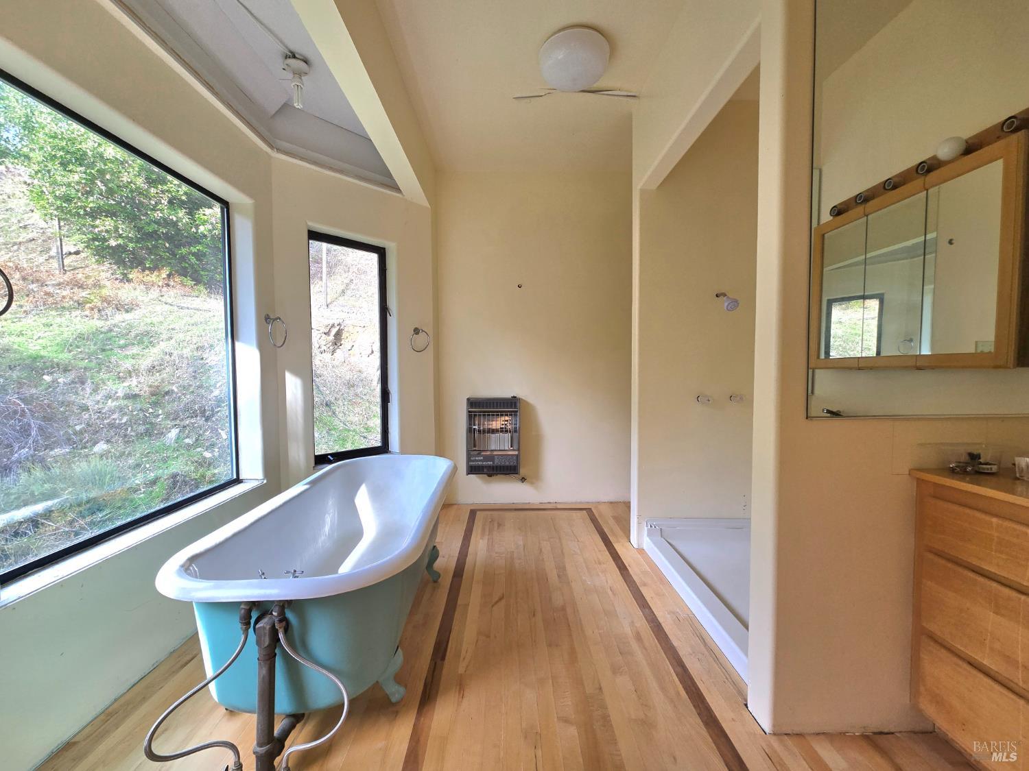 36955 Eureka Stagecoach Road Willits, CA 95490 - Photo 22 of 45 a view of a hallway with furniture and wooden floor