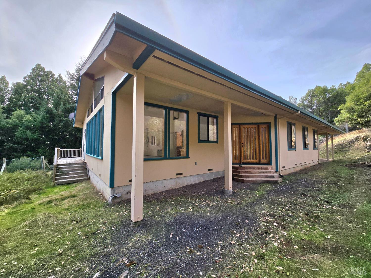 36955 Eureka Stagecoach Road Willits, CA 95490 - Photo 31 of 45 a view of a house with backyard and porch