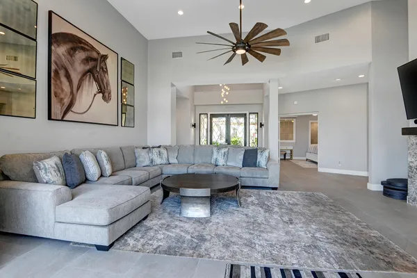 a living room with furniture and a large window