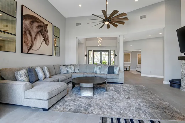 a living room with furniture and a large window