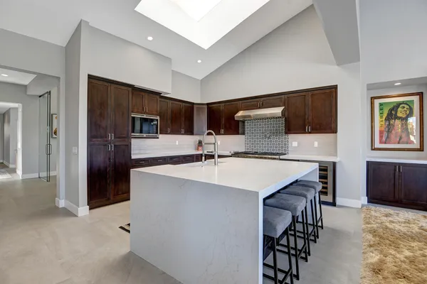 a kitchen with stainless steel appliances a sink stove and refrigerator