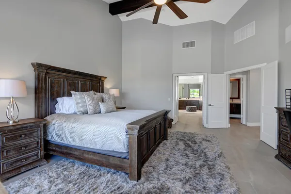 a room with furniture and a floor to ceiling window