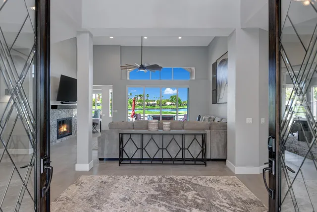 a view of a livingroom with furniture and a flat screen tv