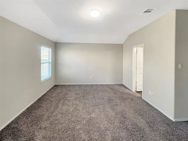 a bathroom with a double vanity sink a mirror and a bathtub