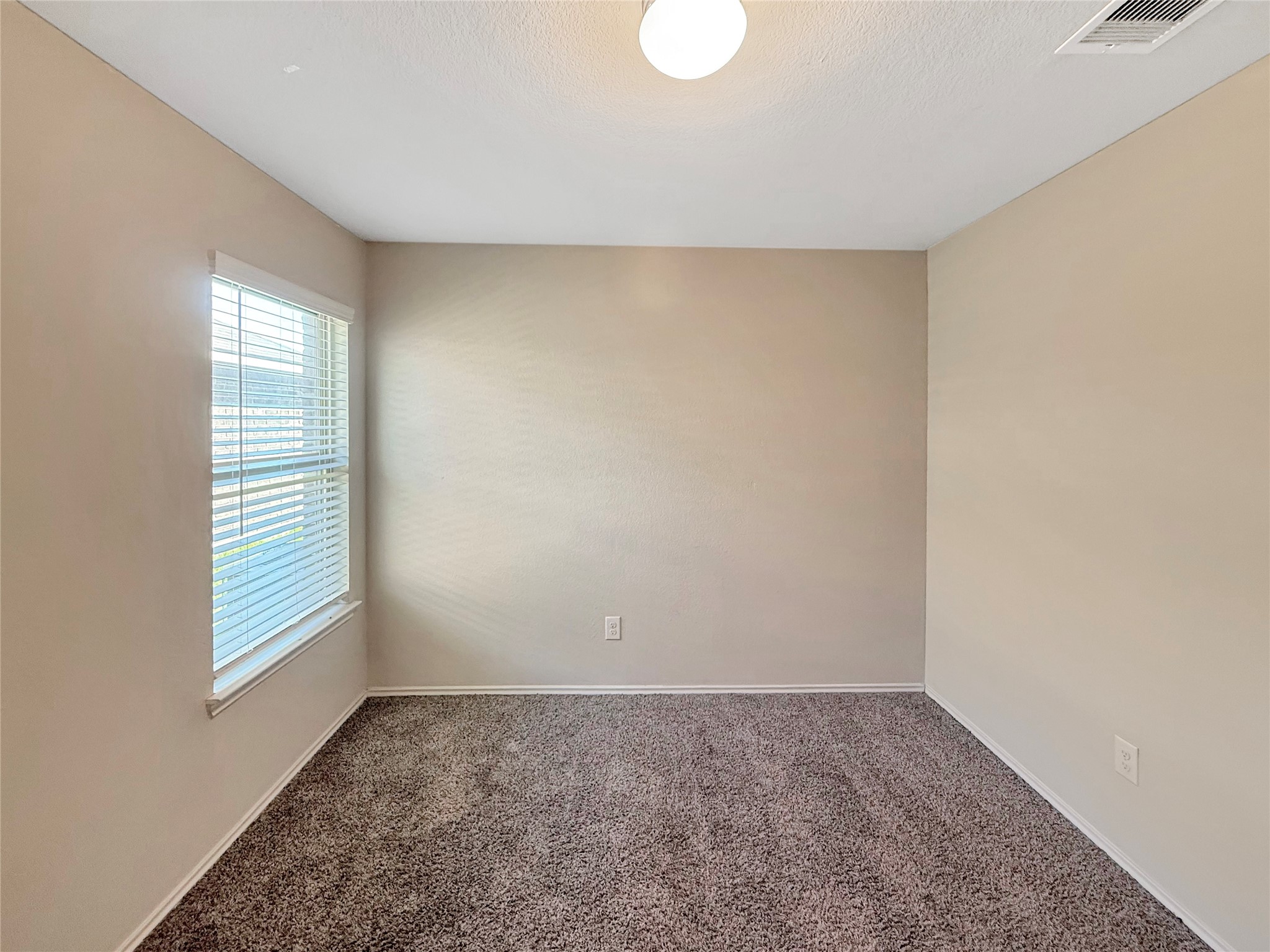 15443 Cipres Verde Street Channelview, TX 77530 - Photo 18 of 27 a view of empty room with window