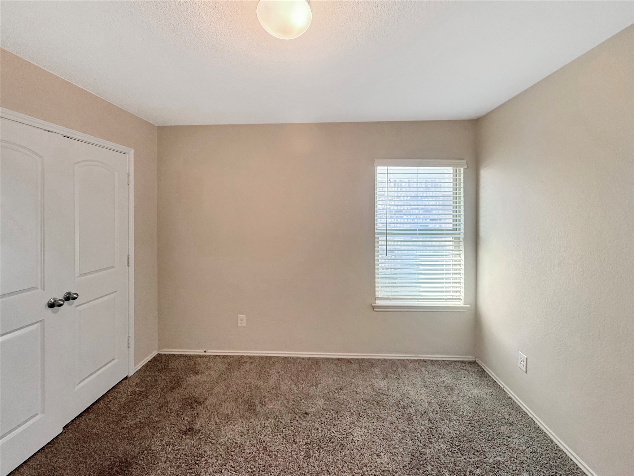 15443 Cipres Verde Street Channelview, TX 77530 - Photo 20 of 27 an empty room with a window